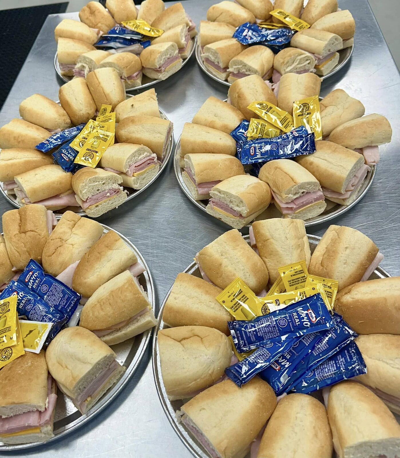 Catering trays of sliders with mustard packets
