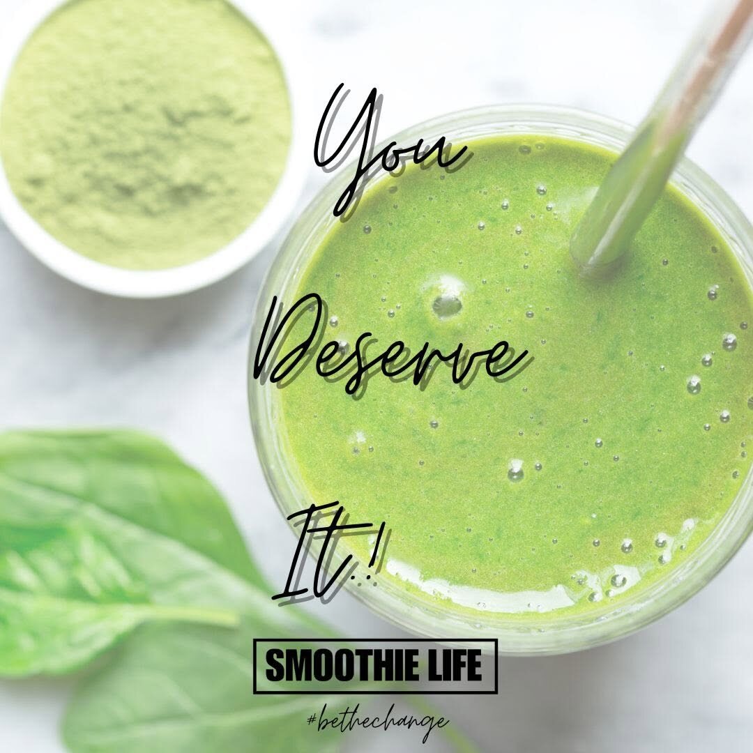 A green smoothie from above with matcha and spinach leaves and the words You Deserve It