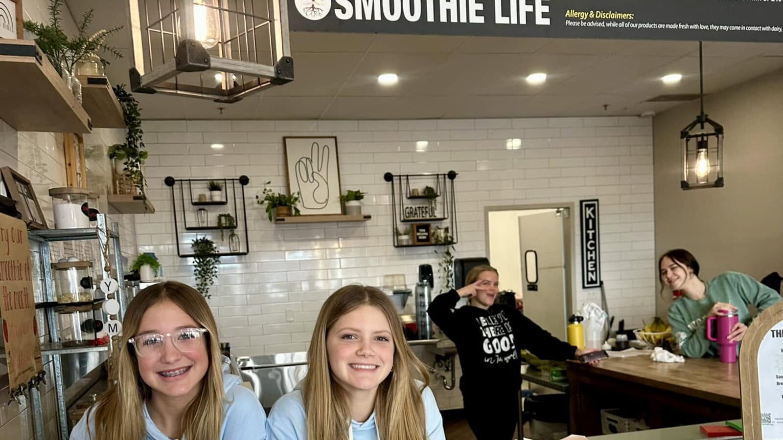 Inside the shop: the counter, the pendant lights and the Smoothie Life menu board