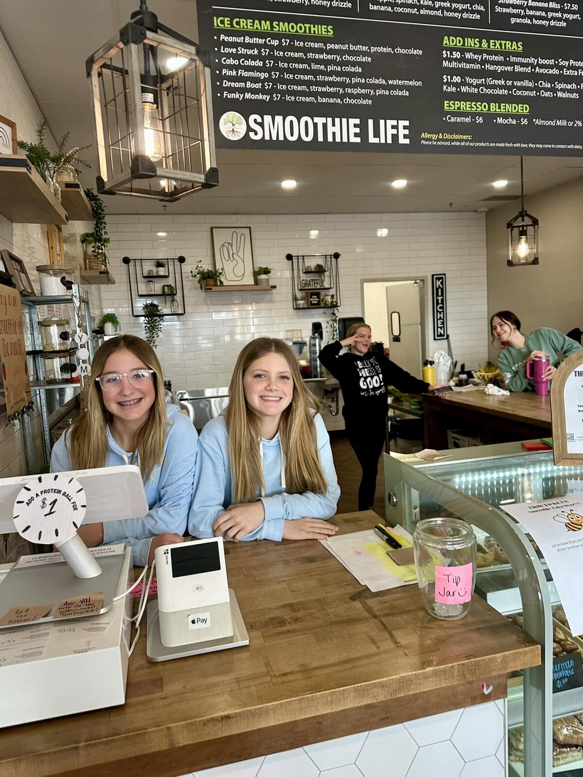 Inside the shop: the counter, the pendant lights and the Smoothie Life menu board