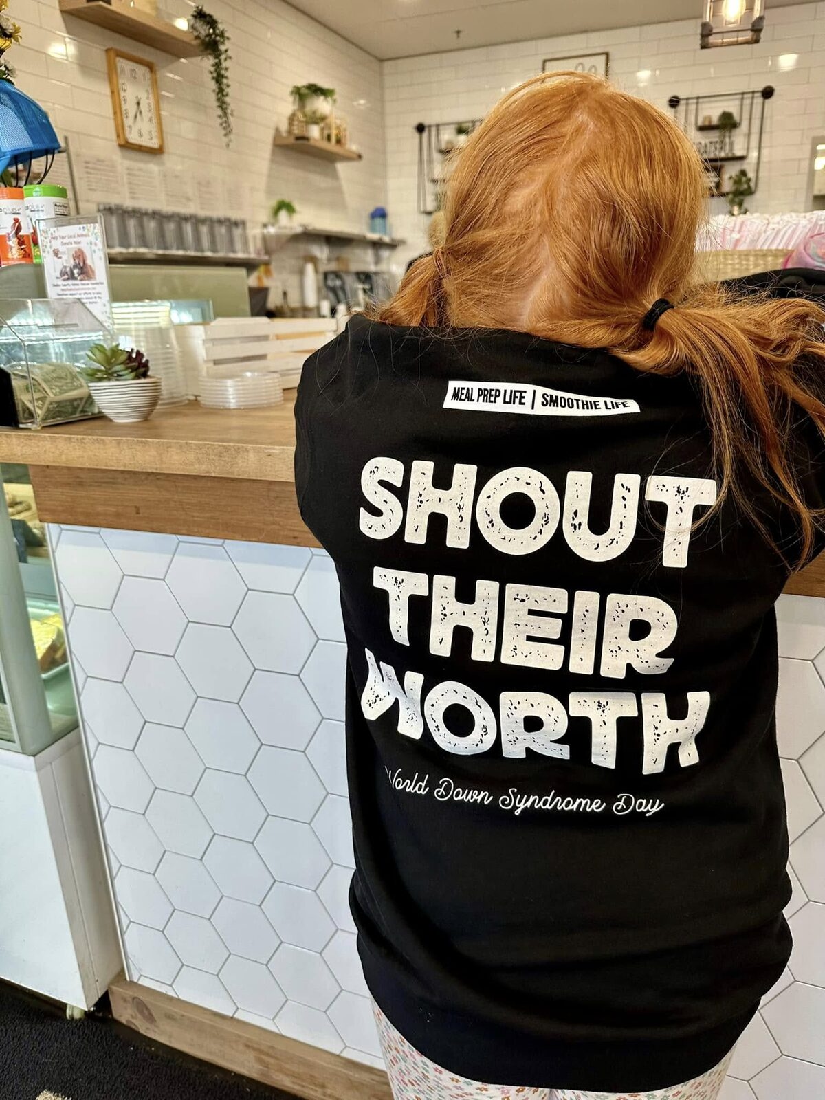 The back of the Shout Their Worth shirt