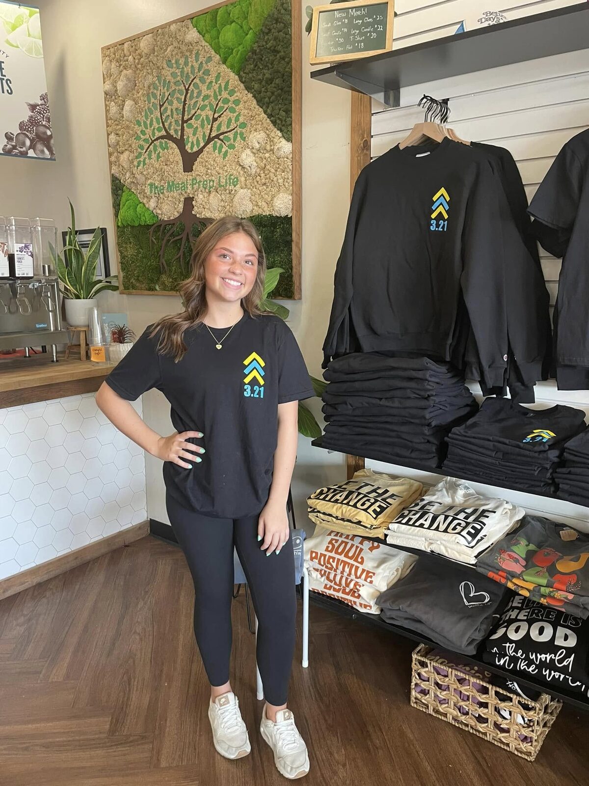 One of the team in the Down Syndrome Day shirt by the merch rail