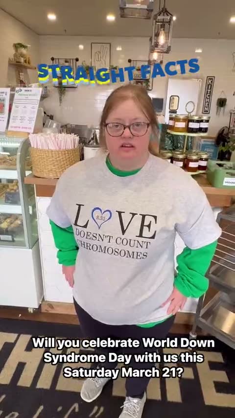 A team member in the Love Doesn't Count Chromosomes shirt at the counter — her reel: Straight facts